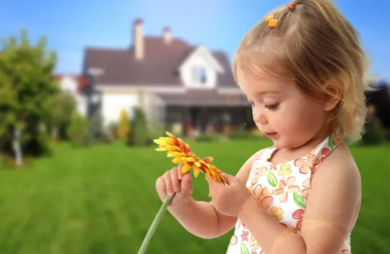 girl in front of house